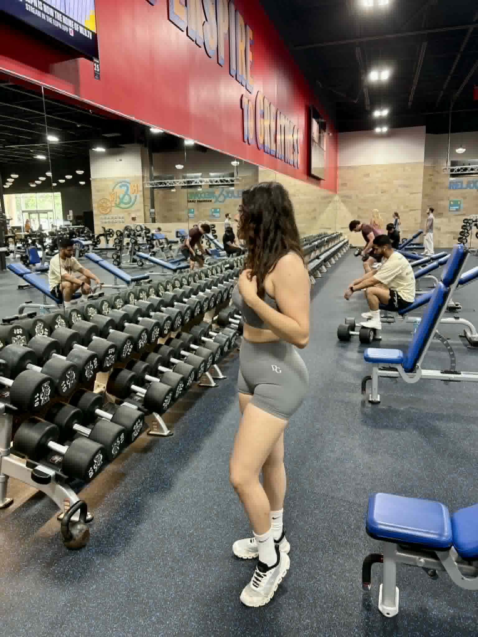 Diva Goddess ambassador wearing Peach Scrunch Gym Shorts at Crunch Fitness DFW